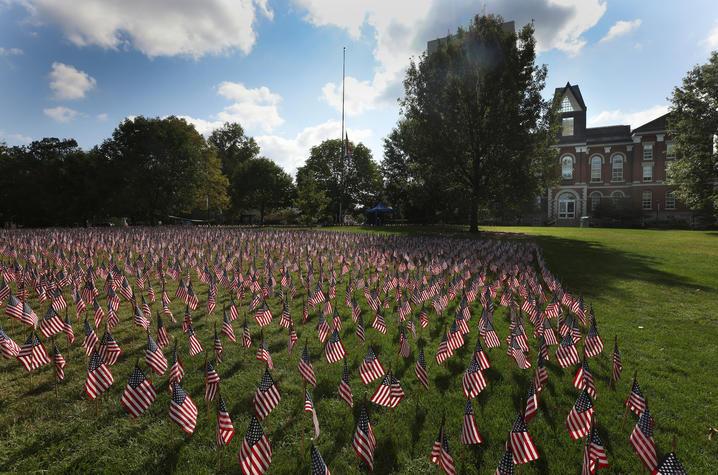 Photo of American flags in front of Main Bldg