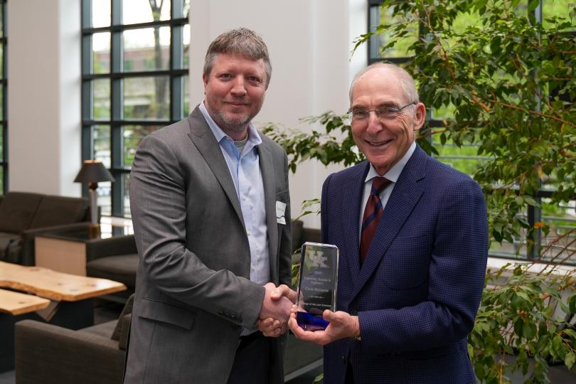 photo of a professor and a university president