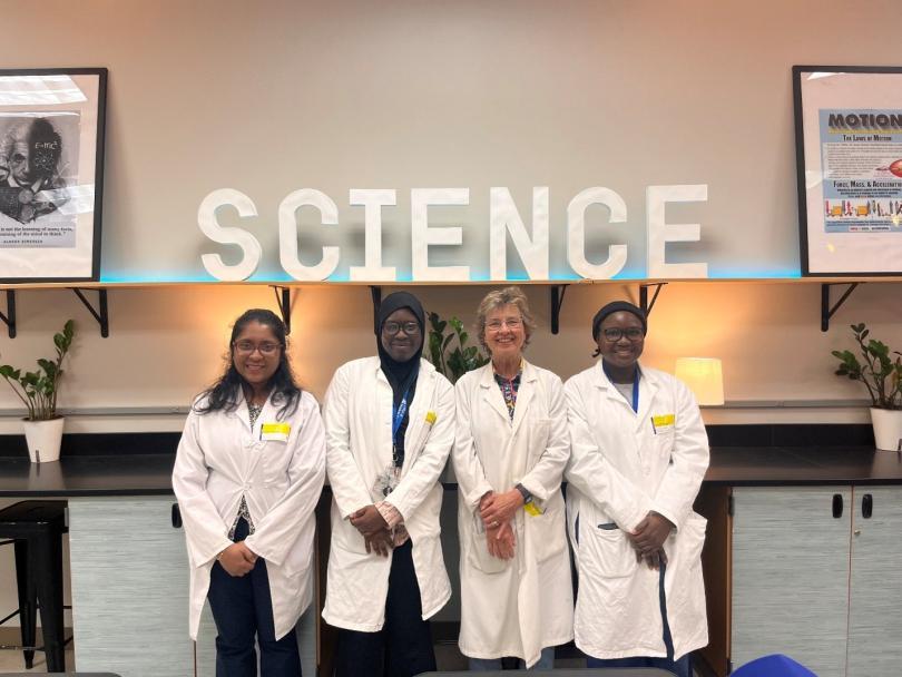 three students and professor